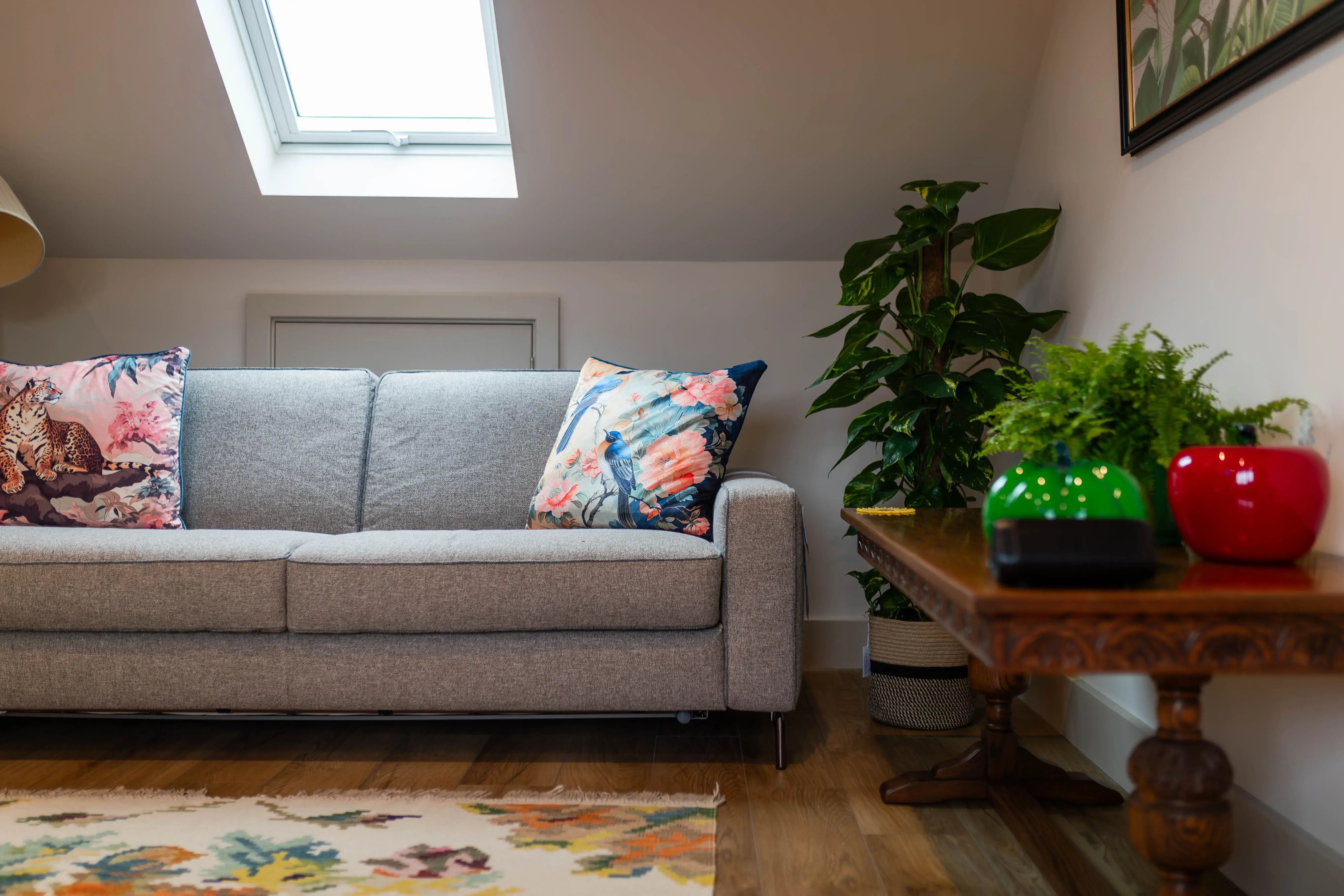 A living room with a couch and a table.