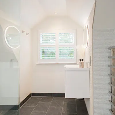 white bathroom with square window